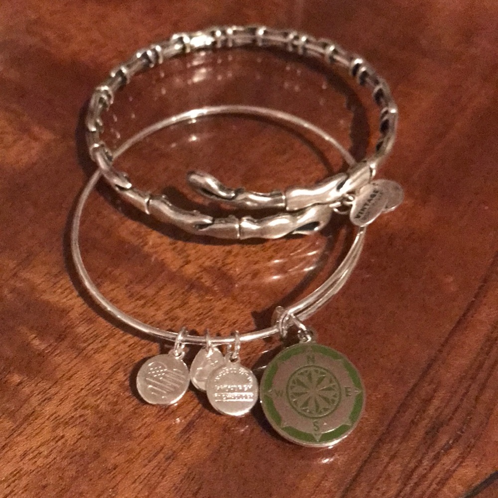 Two Alex and Ani bracelets.